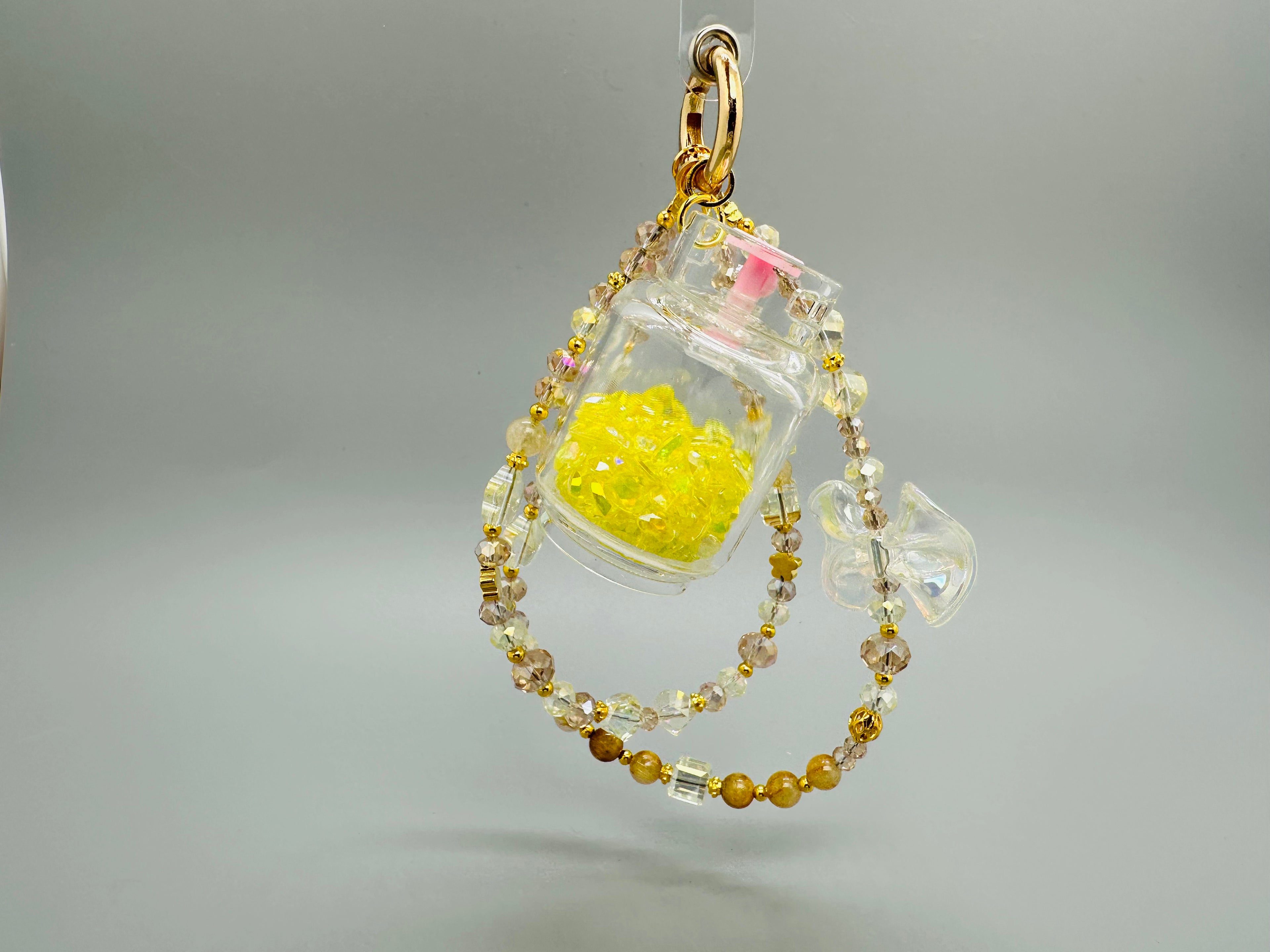 Der gelbe Gasflaschen-Handy Charm aus hochwertigem Citrin